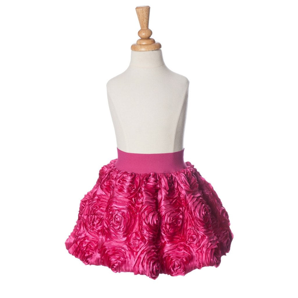 girl wearing pink ribbon rose dress up party skirt