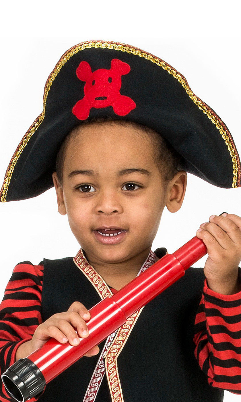 boy wearing pirate hat with red skull and crossbones, eyepatch and pirate bandana