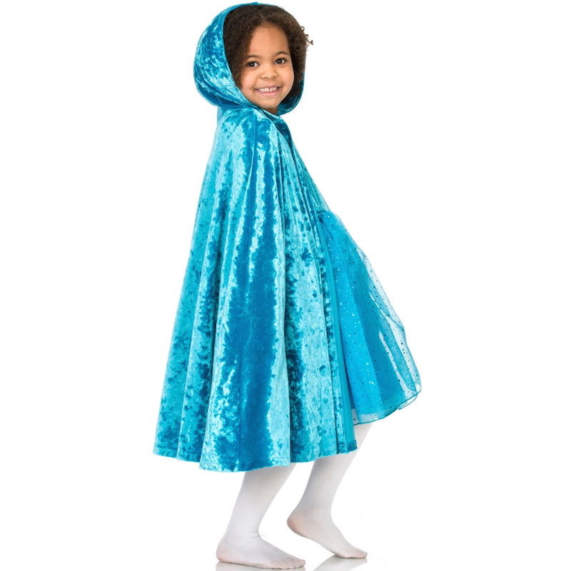 Child wearing turquoise velvet hooded cape