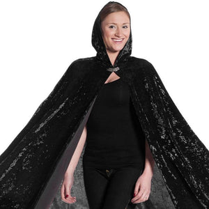 adult wearing black velvet hooded cape