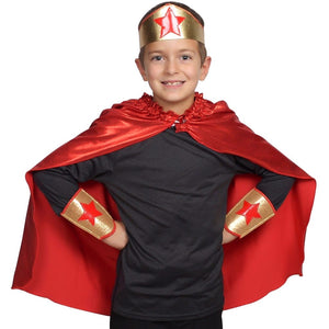 child wearing red superhero cape with crown and armbands
