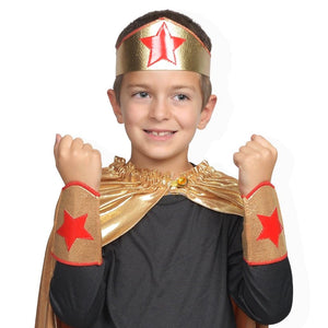 child wearing gold and red superhero crown and arm bands
