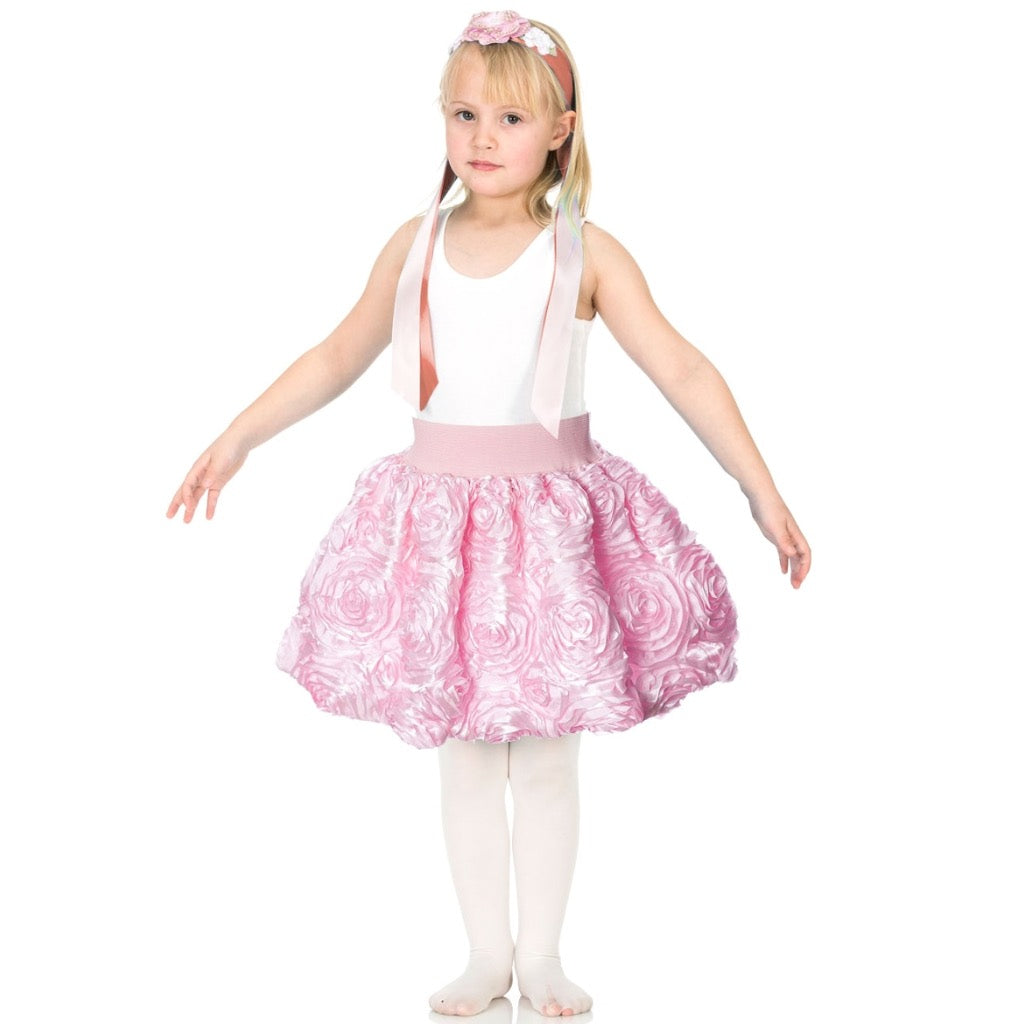 girl wearing pink ribbon rose dress up party skirt