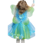 child dressed up in teal fairy dress with blue and green fairy wings