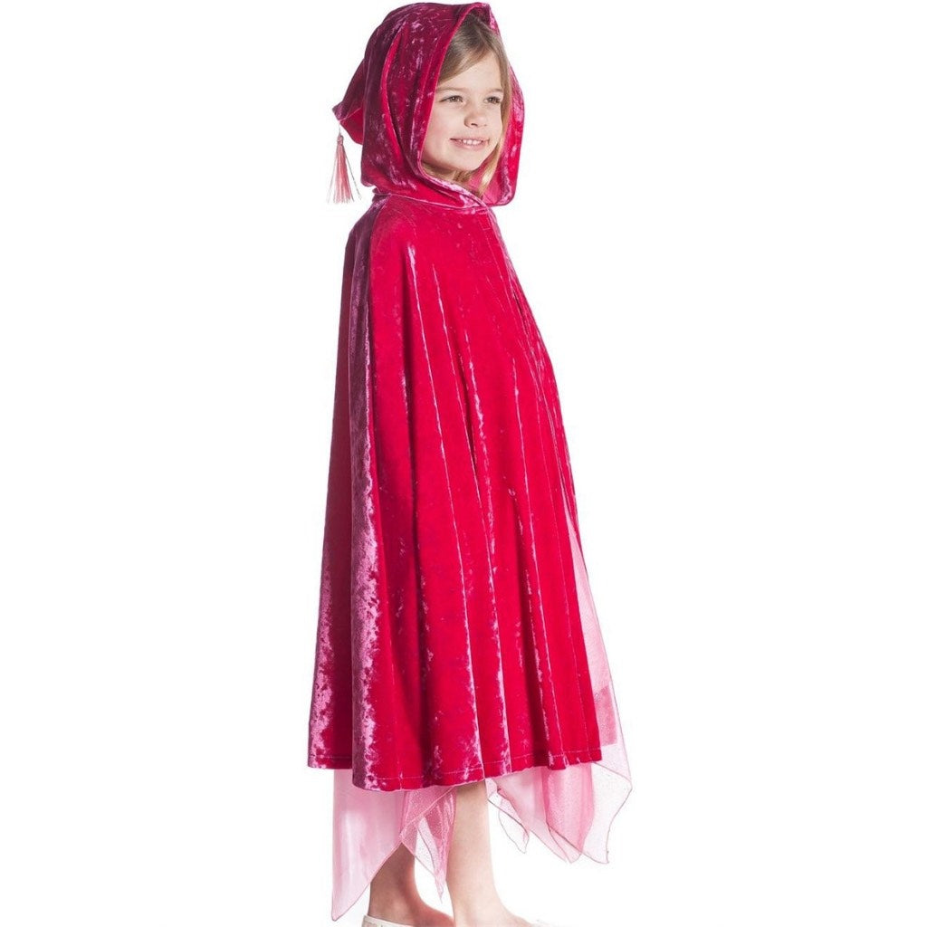 girl wearing fuchsia velvet hooded cape with tassel hood