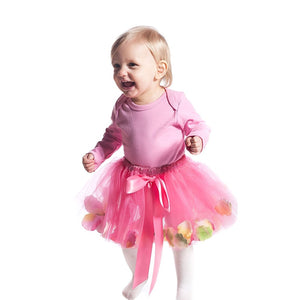 toddler wearing pink fairy tutu skirt with tulle and flower petals