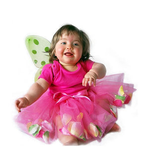 infant wearing fairy wings and pink tulle tutu with flower petals