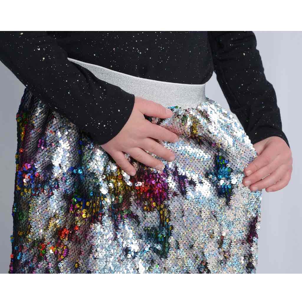 girl wearing multicolor flippy sequin skirt