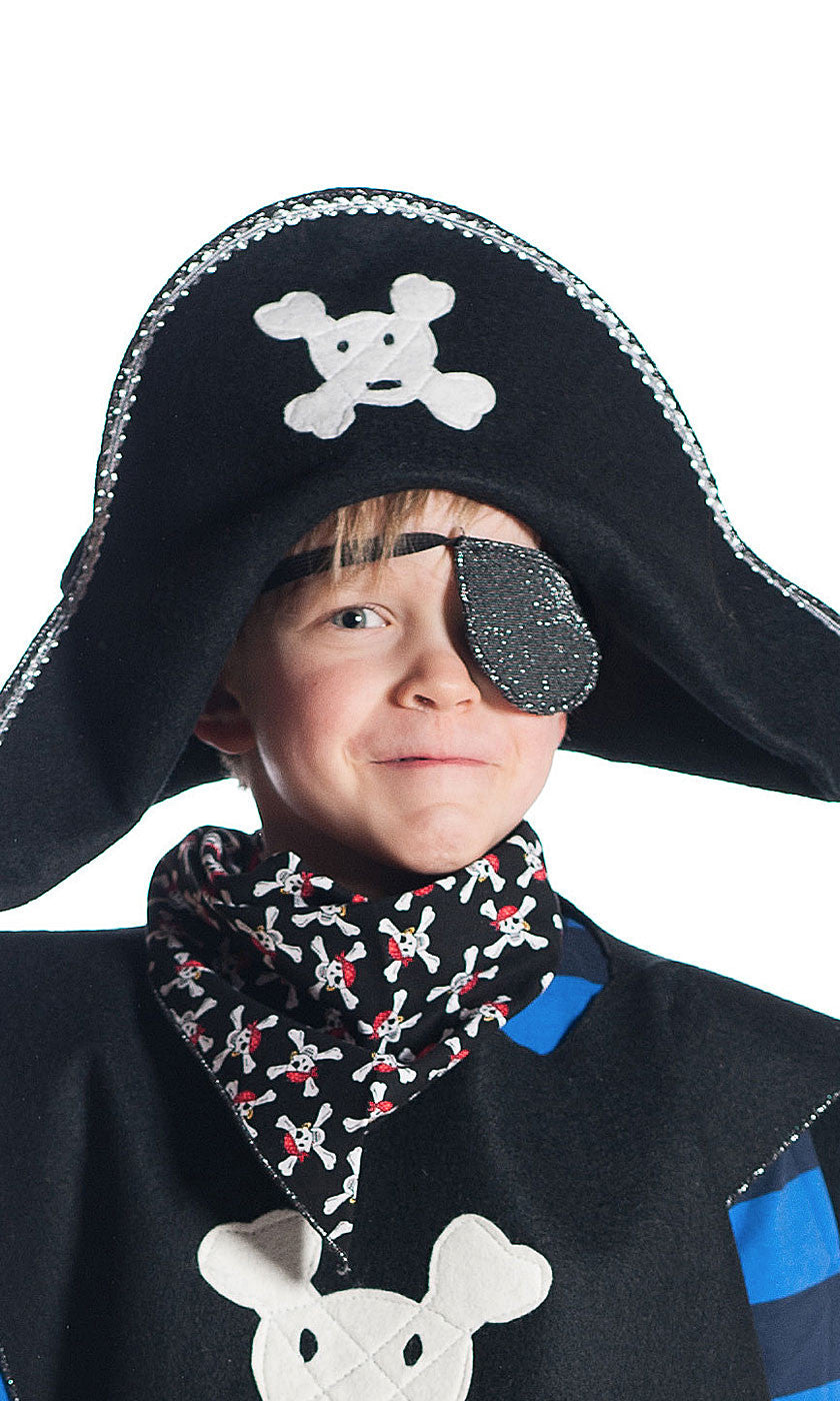 boy wearing pirate hat with red skull and crossbones, eyepatch and pirate bandana