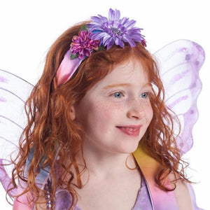 girl wearing rainbow ribbon headband and purple fairy wings