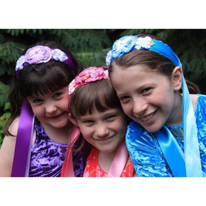 girls wearing flower and ribbon headbands