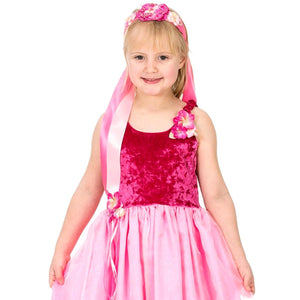 Girl wearing pink flower ribbon headband and princess dress
