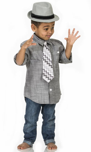 Toddler wearing Fly Guy necktie in gray zigzag print